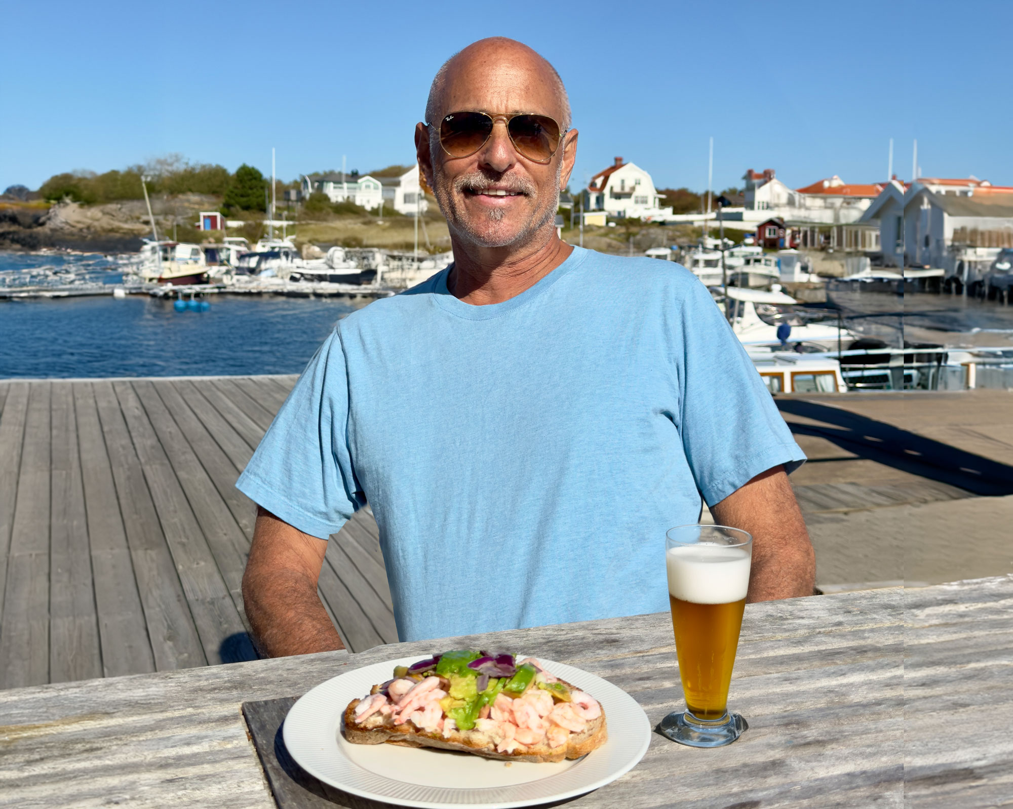 Joakim Lloyd Raboff on the island of Vrangö at Kajkanten Hotel enjoying cold beer and a shrimp sandwich